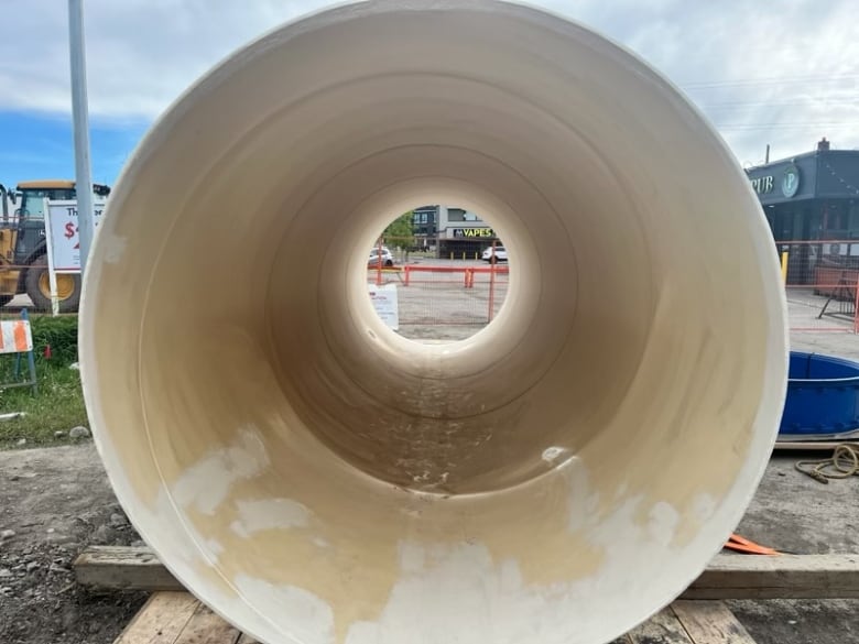 a large, heavy pipe surrounded by large machinery.