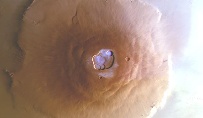 This image of Olympus Mons, the tallest volcano in the entire solar system, was taken early this morning local solar time by the stereo camera on board the European Space Agency's Mars Express.